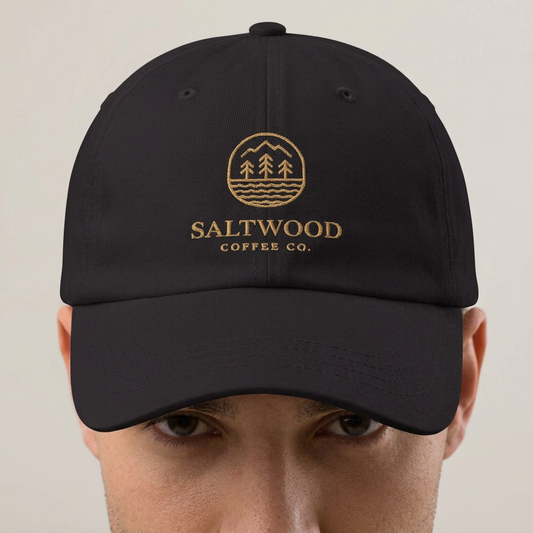 Saltwood Dad Hat with gold logo embroidery, worn