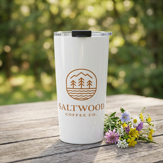 Saltwood Tumbler on a picnic table with wildflowers