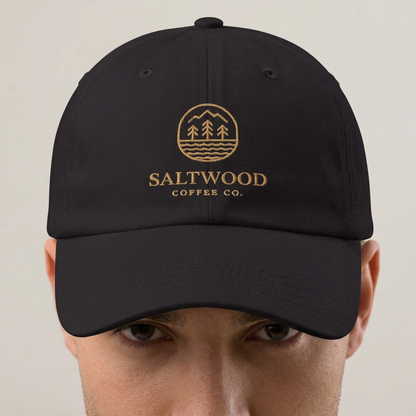 Saltwood Dad Hat with gold logo embroidery, worn