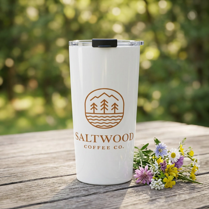 Saltwood Tumbler on a picnic table with wildflowers